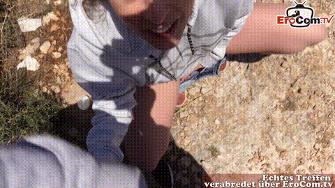 German vacationer gives her boyfriend a blowjob by the sea_p60.gif