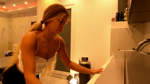 Hot tattooed blonde long hair beauty in the kitchen takes her panties off to sho.gif